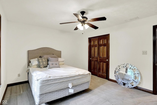 1456 Bent Tree Pl, Greenwood, IN 46143 - bedroom with light colored carpet, a closet, and a ceiling fan