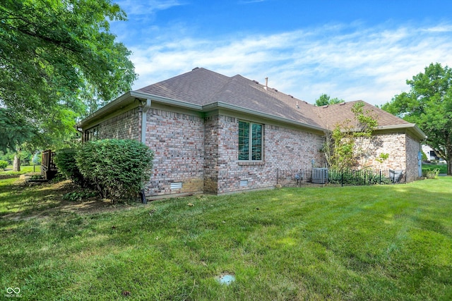 1456 Bent Tree Pl, Greenwood, IN 46143 - view of home's exterior with brick siding, a lawn, and a shingled roof
