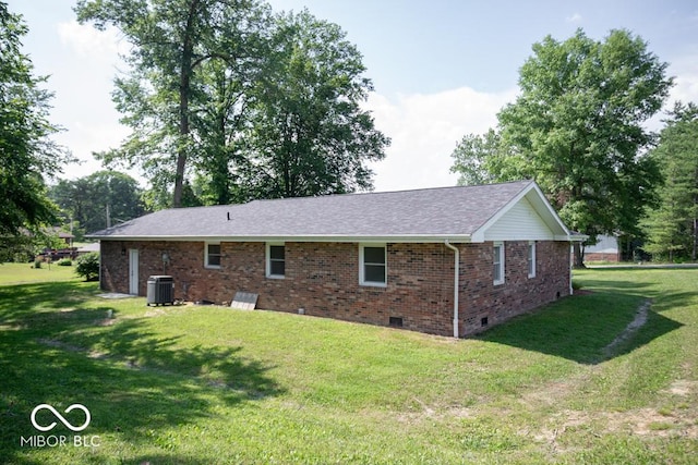 1855 E Deb Dr, North Vernon, IN 47265 - rear view of property with crawl space, brick siding, a yard, and a shingled roof