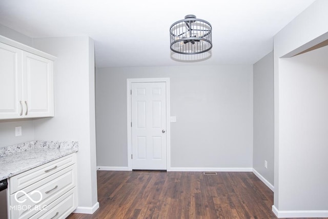 1855 E Deb Dr, North Vernon, IN 47265 - unfurnished dining area with dark wood-type flooring and a chandelier