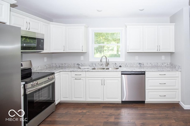 1855 E Deb Dr, North Vernon, IN 47265 - kitchen featuring stainless steel appliances, white cabinetry, light stone counters, and dark wood-style flooring