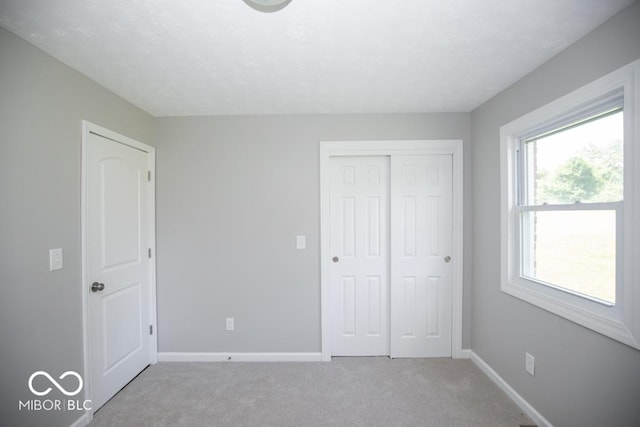 1855 E Deb Dr, North Vernon, IN 47265 - unfurnished bedroom with light colored carpet and a closet