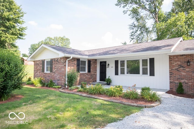 1855 E Deb Dr, North Vernon, IN 47265 - ranch-style house featuring brick siding, a front yard, and roof with shingles