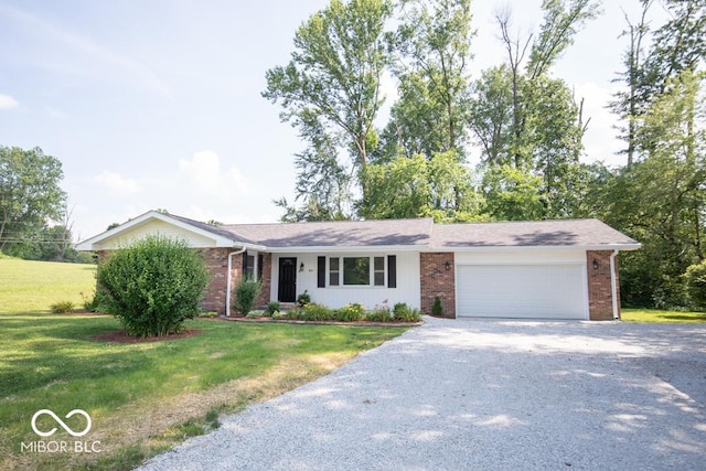 1855 E Deb Dr, North Vernon, IN 47265 - ranch-style house with gravel driveway, brick siding, a garage, and a front yard