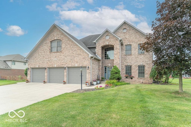1035 White Oak Dr, Plainfield, IN 46168 - view of front of property featuring driveway, a front yard, a garage, and brick siding