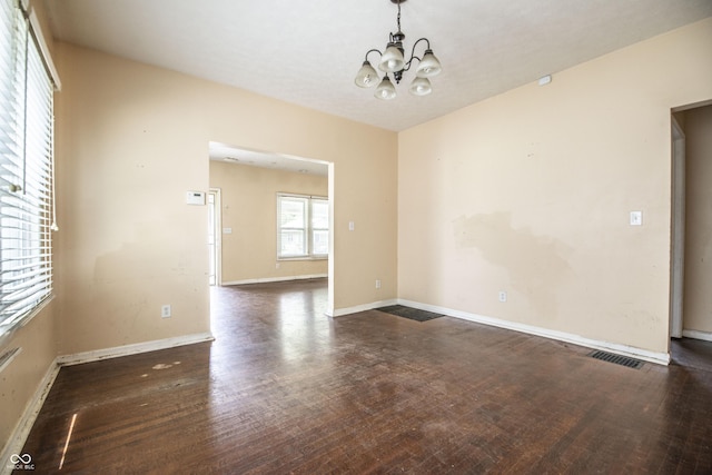 611 N Bradley Ave, Indianapolis, IN 46201 - spare room featuring a chandelier and wood finished floors
