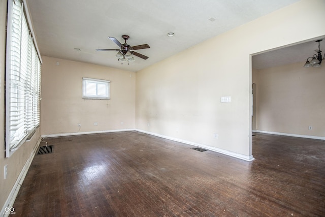 611 N Bradley Ave, Indianapolis, IN 46201 - spare room featuring a ceiling fan, wood finished floors, and a chandelier