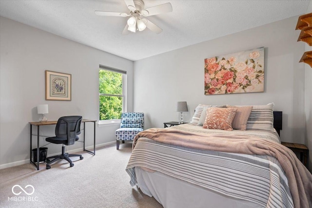 8827 Lindsey Ct, Fishers, IN 46038 - carpeted bedroom with ceiling fan, a desk, and a textured ceiling