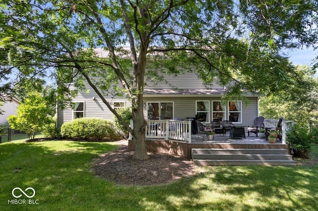 8827 Lindsey Ct, Fishers, IN 46038 - rear view of house featuring a lawn and a wooden deck