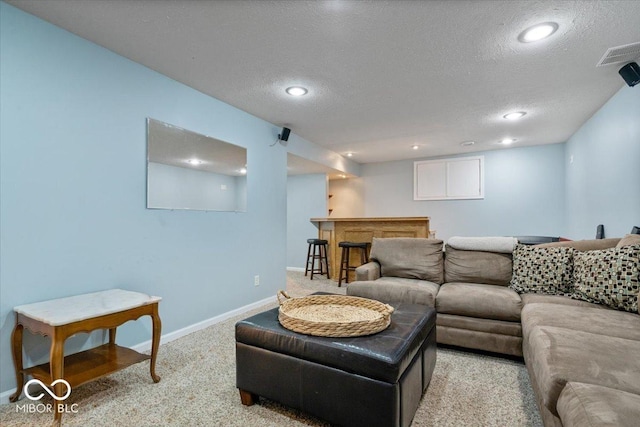 8827 Lindsey Ct, Fishers, IN 46038 - living room featuring light colored carpet, a textured ceiling, recessed lighting, and a dry bar
