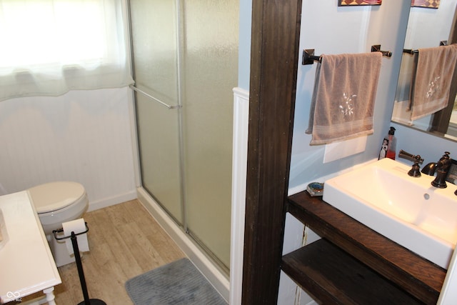 705 Terrace Ln, Greencastle, IN 46135 - bathroom with a stall shower, vanity, and wood finished floors