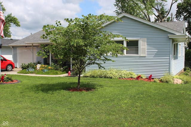 705 Terrace Ln, Greencastle, IN 46135 - view of front of home featuring an attached garage, roof with shingles, and a front yard