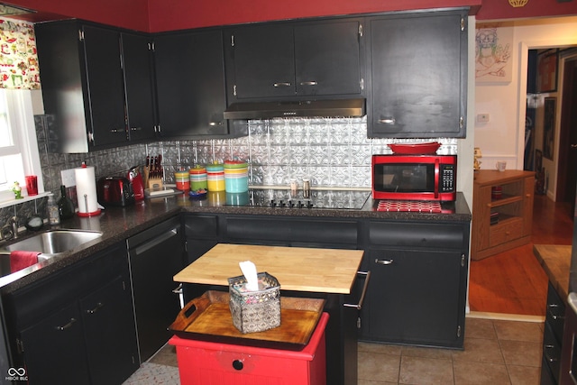 705 Terrace Ln, Greencastle, IN 46135 - kitchen featuring black appliances, under cabinet range hood, butcher block countertops, decorative backsplash, and dark cabinets