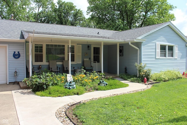 705 Terrace Ln, Greencastle, IN 46135 - view of front facade with a porch, a front lawn, roof with shingles, and a garage