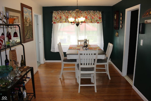 705 Terrace Ln, Greencastle, IN 46135 - dining space with a chandelier, healthy amount of natural light, and wood finished floors