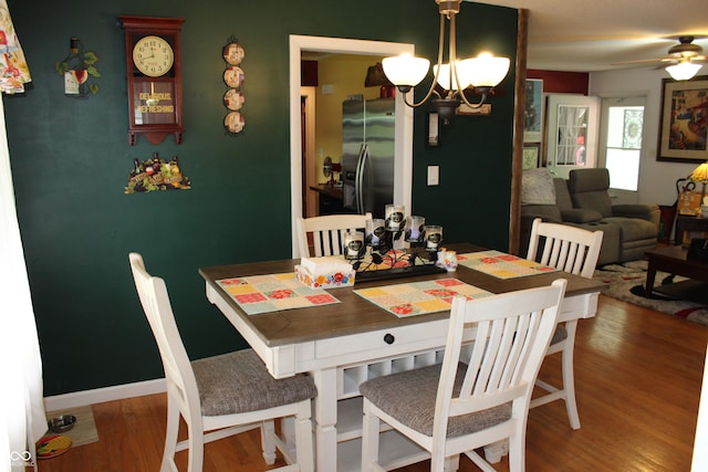 705 Terrace Ln, Greencastle, IN 46135 - dining room with a chandelier, wood finished floors, and a ceiling fan