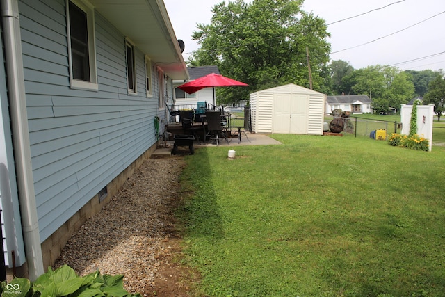 705 Terrace Ln, Greencastle, IN 46135 - view of yard featuring a storage unit, a patio area, and outdoor dining space