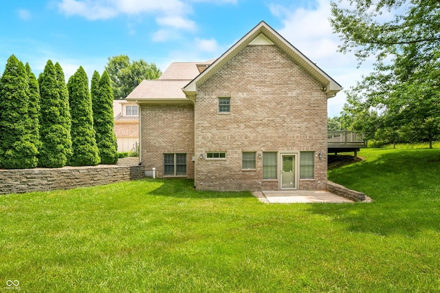 1008 Westcreek Dr, Columbus, IN 47201 - rear view of house with a patio area, a yard, brick siding, and a deck