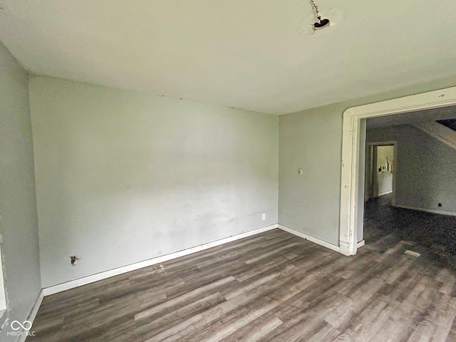 21 N Gladstone Ave, Indianapolis, IN 46201 - empty room with dark wood-style floors and baseboards