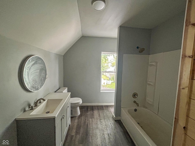 21 N Gladstone Ave, Indianapolis, IN 46201 - bathroom featuring vanity, lofted ceiling, wood finished floors, and bathing tub / shower combination