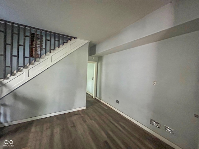 21 N Gladstone Ave, Indianapolis, IN 46201 - unfurnished living room featuring wood finished floors and stairs