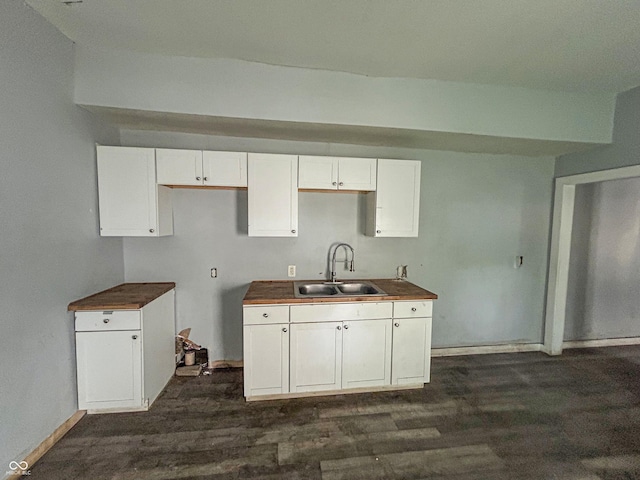 21 N Gladstone Ave, Indianapolis, IN 46201 - kitchen featuring dark wood-style floors and white cabinetry