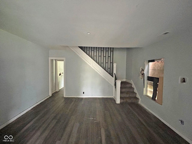 21 N Gladstone Ave, Indianapolis, IN 46201 - unfurnished living room featuring stairway and a tiled fireplace