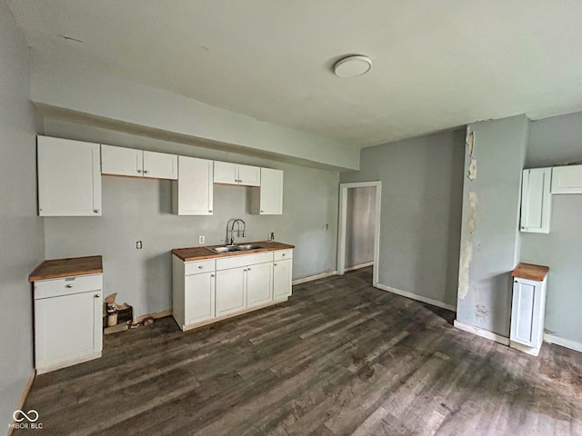 21 N Gladstone Ave, Indianapolis, IN 46201 - kitchen with dark wood finished floors and white cabinets