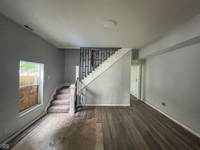 21 N Gladstone Ave, Indianapolis, IN 46201 - unfurnished living room with stairs and wood finished floors