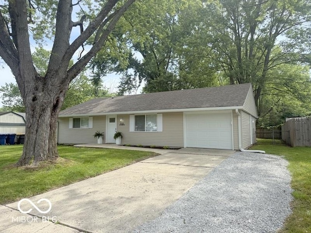 1306 Woodbine Dr, Anderson, IN 46011 - ranch-style home featuring an attached garage and concrete driveway