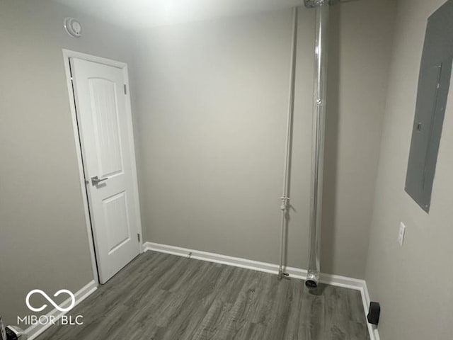1306 Woodbine Dr, Anderson, IN 46011 - spare room featuring dark wood-type flooring and electric panel