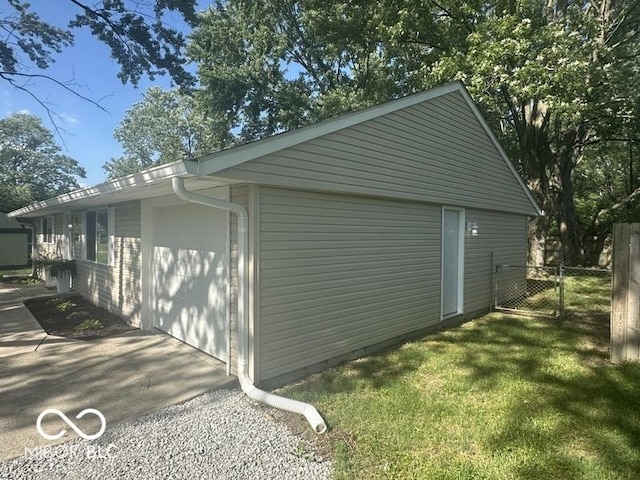 1306 Woodbine Dr, Anderson, IN 46011 - view of outbuilding with a garage and a gate