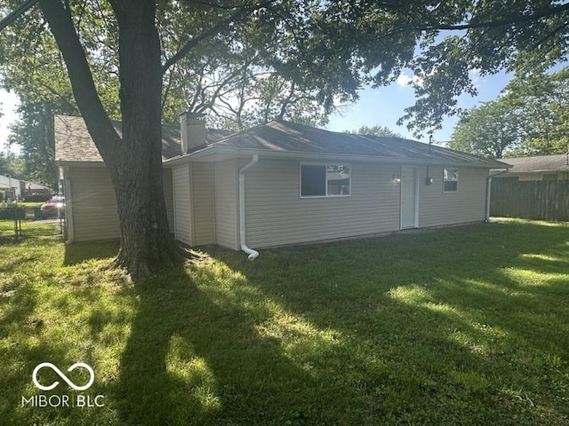 1306 Woodbine Dr, Anderson, IN 46011 - back of house featuring a chimney