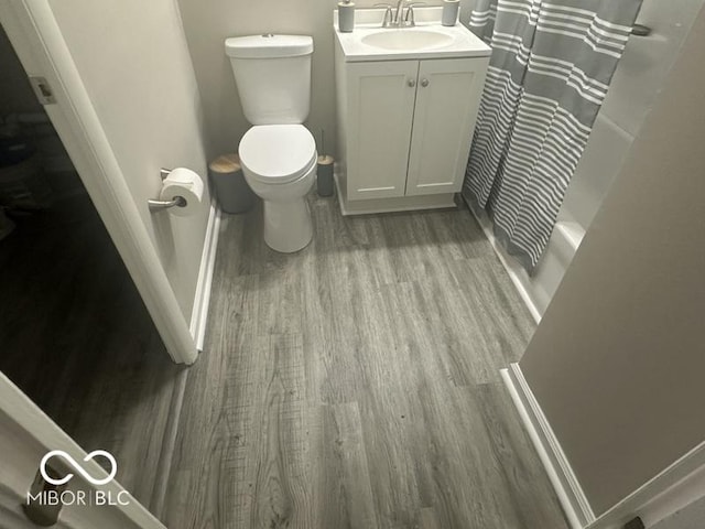 1306 Woodbine Dr, Anderson, IN 46011 - full bath with wood finished floors and vanity