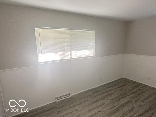 1306 Woodbine Dr, Anderson, IN 46011 - empty room with dark wood-style floors