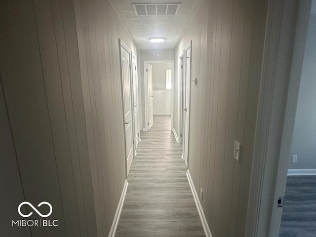 1306 Woodbine Dr, Anderson, IN 46011 - hall with wood finished floors and wood walls