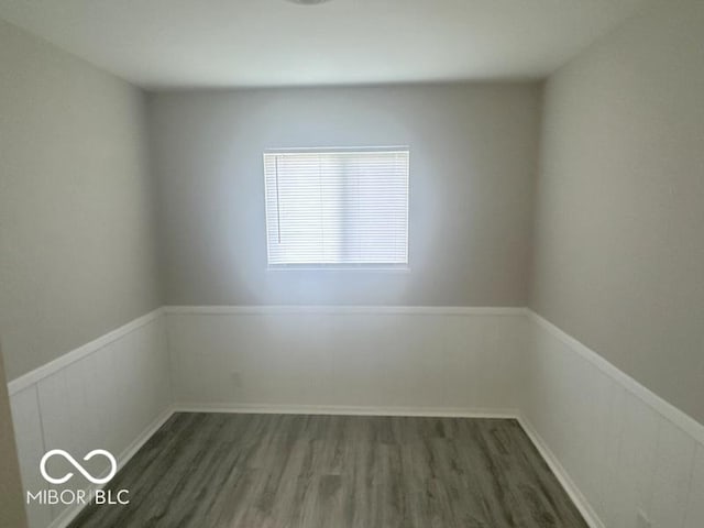 1306 Woodbine Dr, Anderson, IN 46011 - spare room with wood finished floors