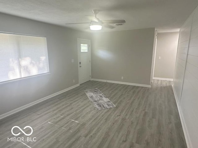 1306 Woodbine Dr, Anderson, IN 46011 - empty room featuring wood finished floors and a ceiling fan