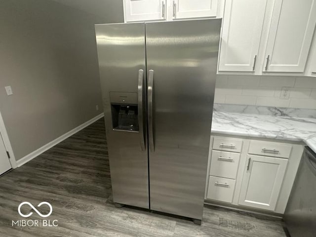 1306 Woodbine Dr, Anderson, IN 46011 - kitchen featuring stainless steel appliances, wood finished floors, white cabinets, light stone counters, and backsplash