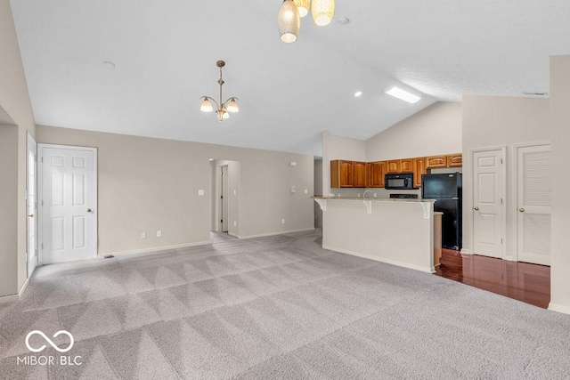 1139 Fernwood Way, Plainfield, IN 46168 - kitchen featuring black appliances, brown cabinets, light colored carpet, open floor plan, and high vaulted ceiling