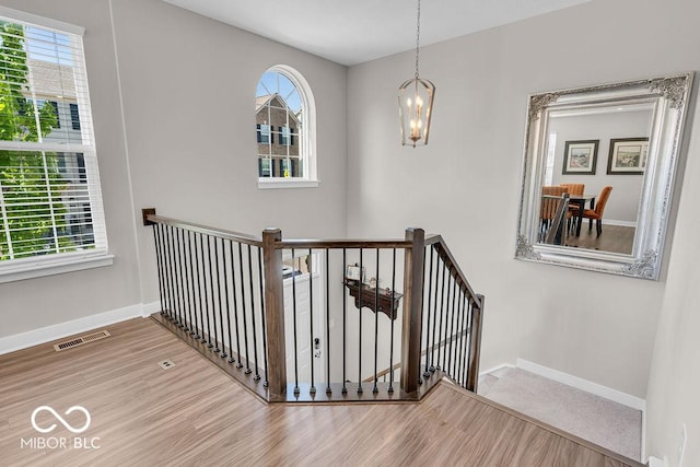 3546 Brampton Ln, Westfield, IN 46074 - stairway with wood finished floors and a chandelier