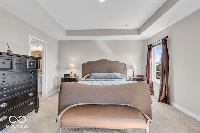 3546 Brampton Ln, Westfield, IN 46074 - bedroom featuring light carpet, a tray ceiling, and ensuite bath