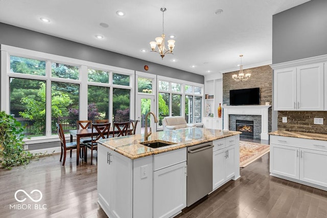 720 Willow Pointe N Dr, Plainfield, IN 46168 - kitchen with dishwasher, a chandelier, a fireplace, open floor plan, and recessed lighting