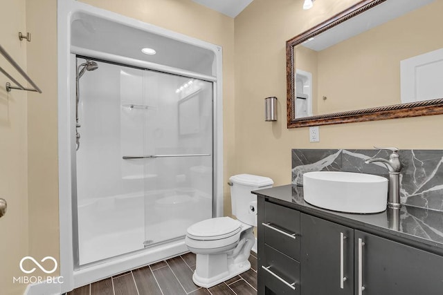 720 Willow Pointe N Dr, Plainfield, IN 46168 - full bathroom with a shower stall, vanity, tasteful backsplash, and wood finished floors
