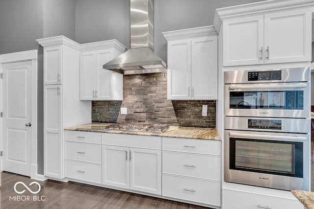 720 Willow Pointe N Dr, Plainfield, IN 46168 - kitchen featuring wall chimney range hood, stainless steel appliances, white cabinets, and light stone counters