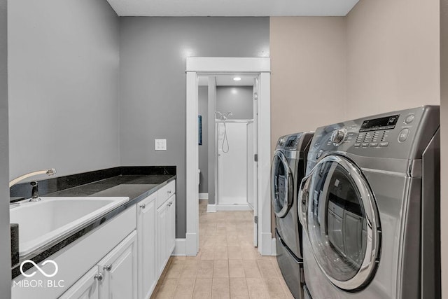720 Willow Pointe N Dr, Plainfield, IN 46168 - laundry room with washing machine and dryer, light tile patterned floors, and cabinet space