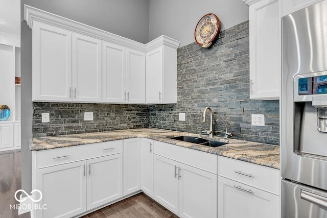 720 Willow Pointe N Dr, Plainfield, IN 46168 - kitchen featuring stainless steel refrigerator with ice dispenser, white cabinets, backsplash, and light stone countertops