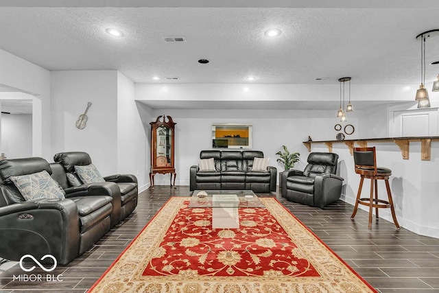720 Willow Pointe N Dr, Plainfield, IN 46168 - living room featuring a textured ceiling, wood tiled floors, and recessed lighting