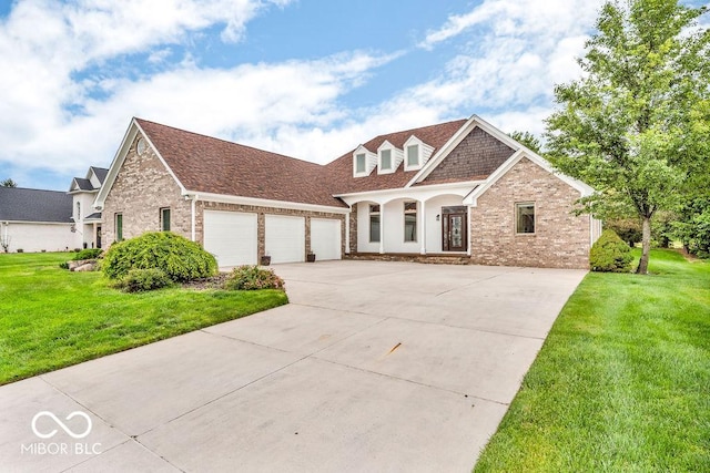 720 Willow Pointe N Dr, Plainfield, IN 46168 - view of front facade with concrete driveway, a garage, brick siding, and a front yard