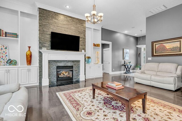 720 Willow Pointe N Dr, Plainfield, IN 46168 - living room featuring wood finished floors, a fireplace, a chandelier, and recessed lighting